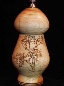 Pyrographed parsley on the pepper grinder